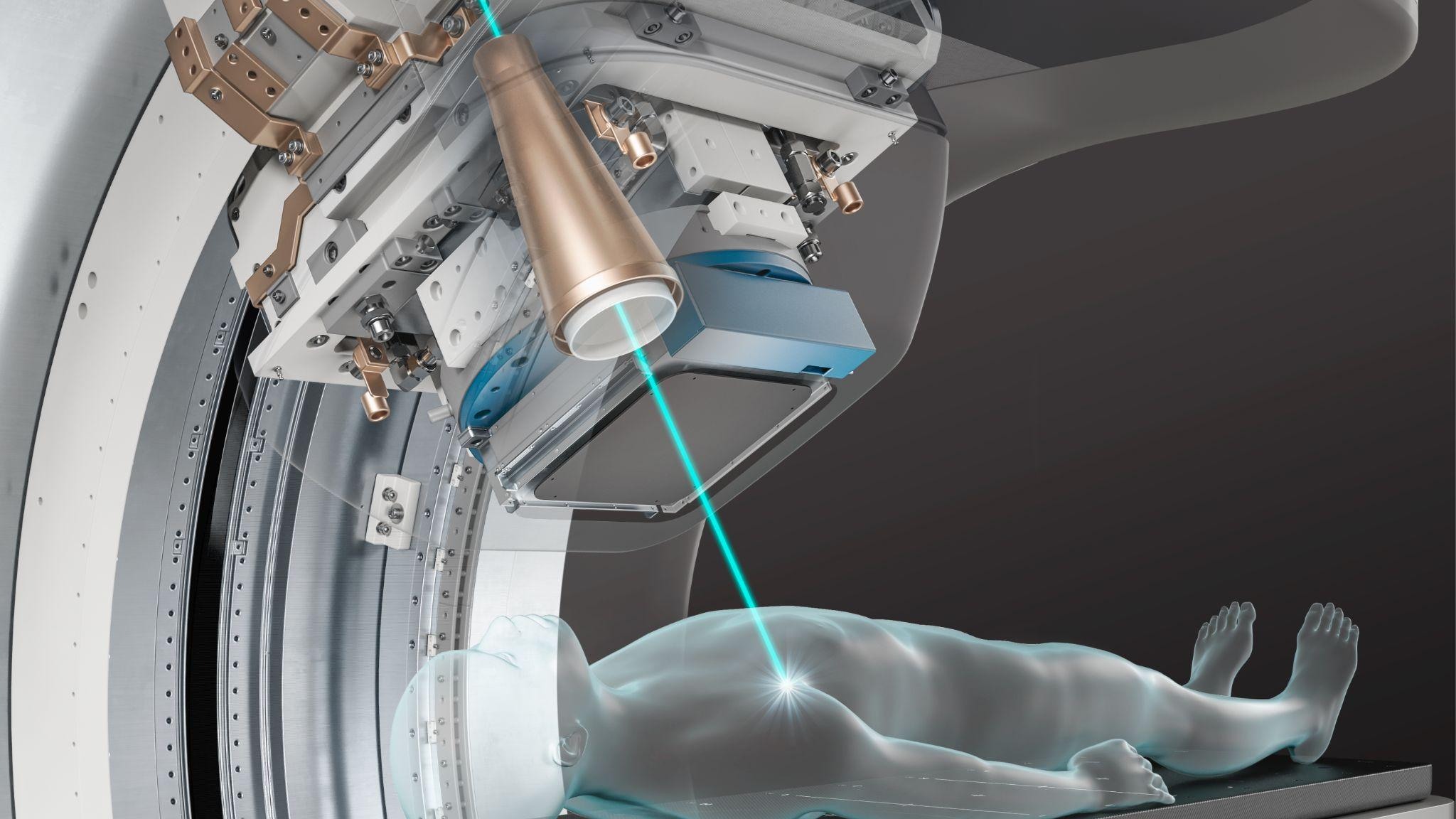 Phemto proton beam therapy treatment head, teal beam converging on patient positioning couch